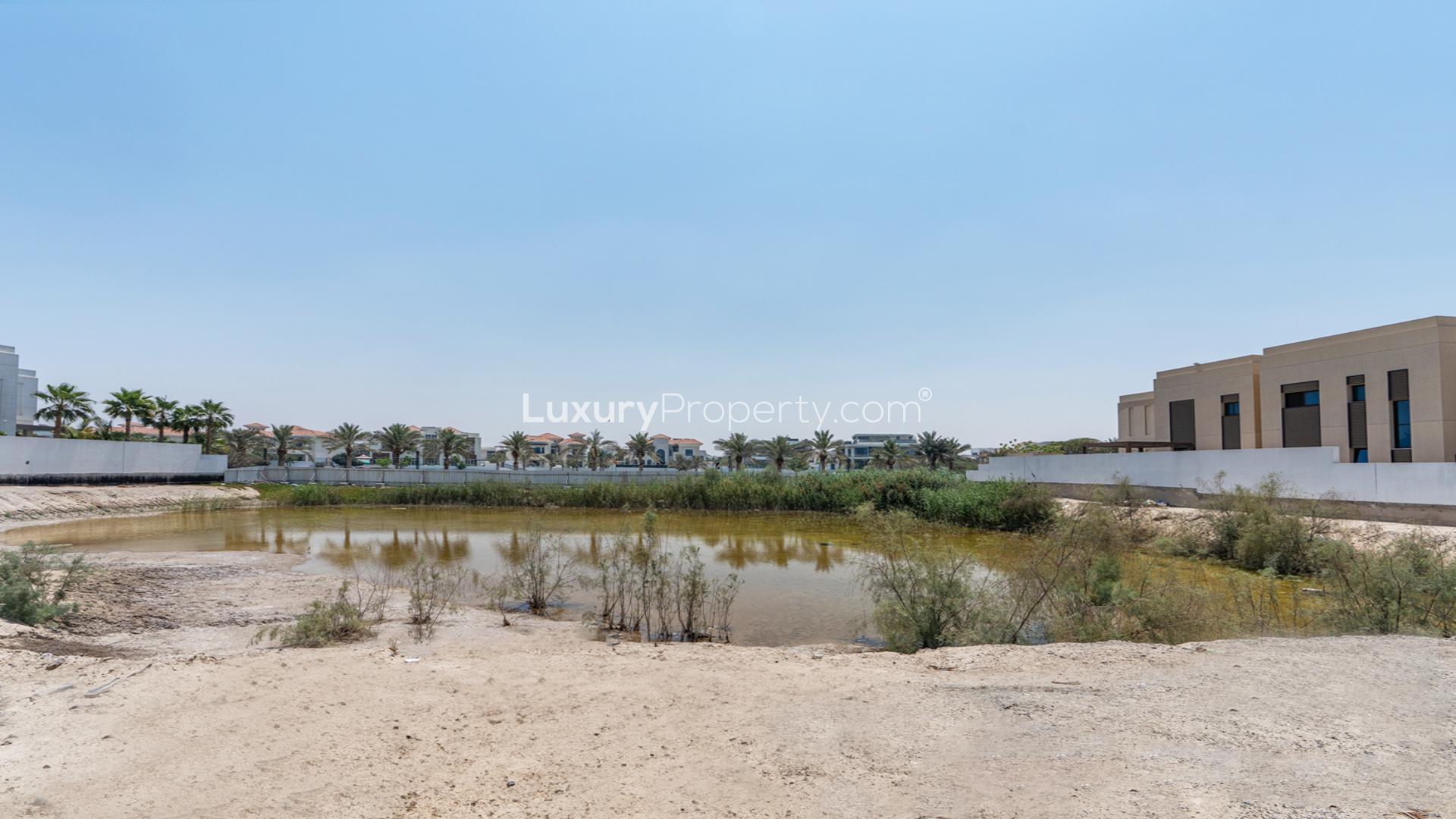 Double mansion plot on lagoon, District One, Mohammed Bin Rashid City skyline view