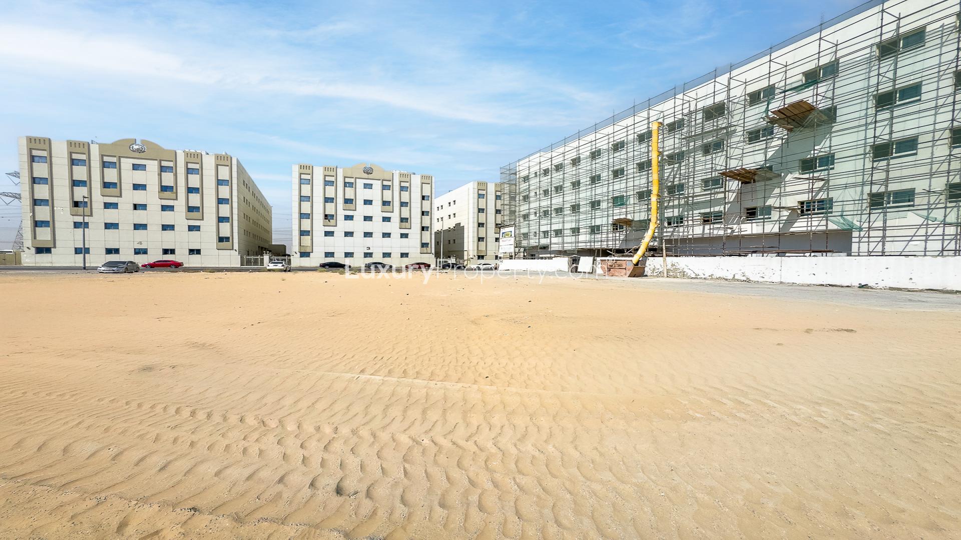 G+4 approved plot for sale in Al Khawaneej 1, surrounded by buildings