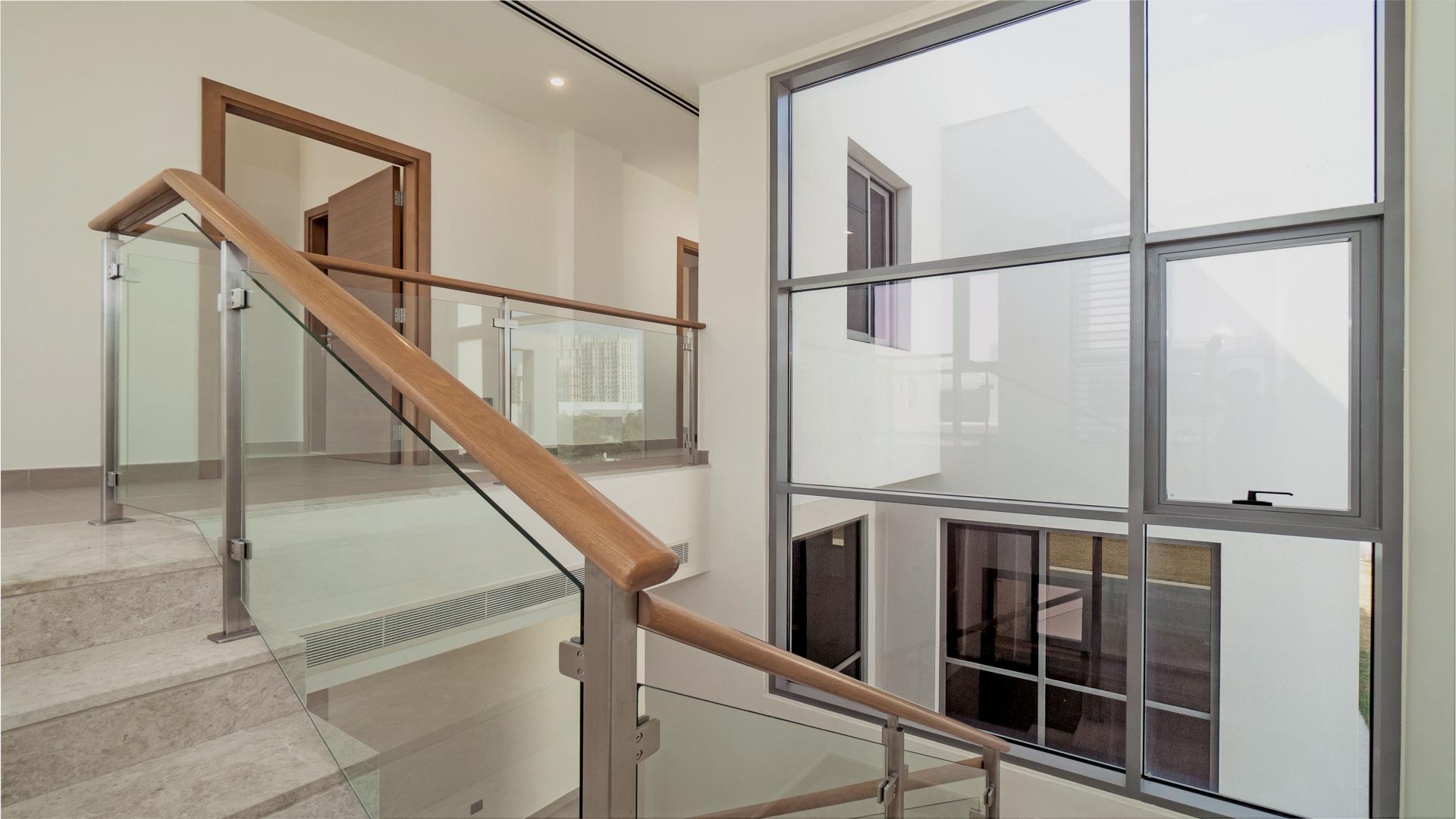 Spacious bedroom with built-in wooden closet in Sidra Villas, Dubai Hills Estate