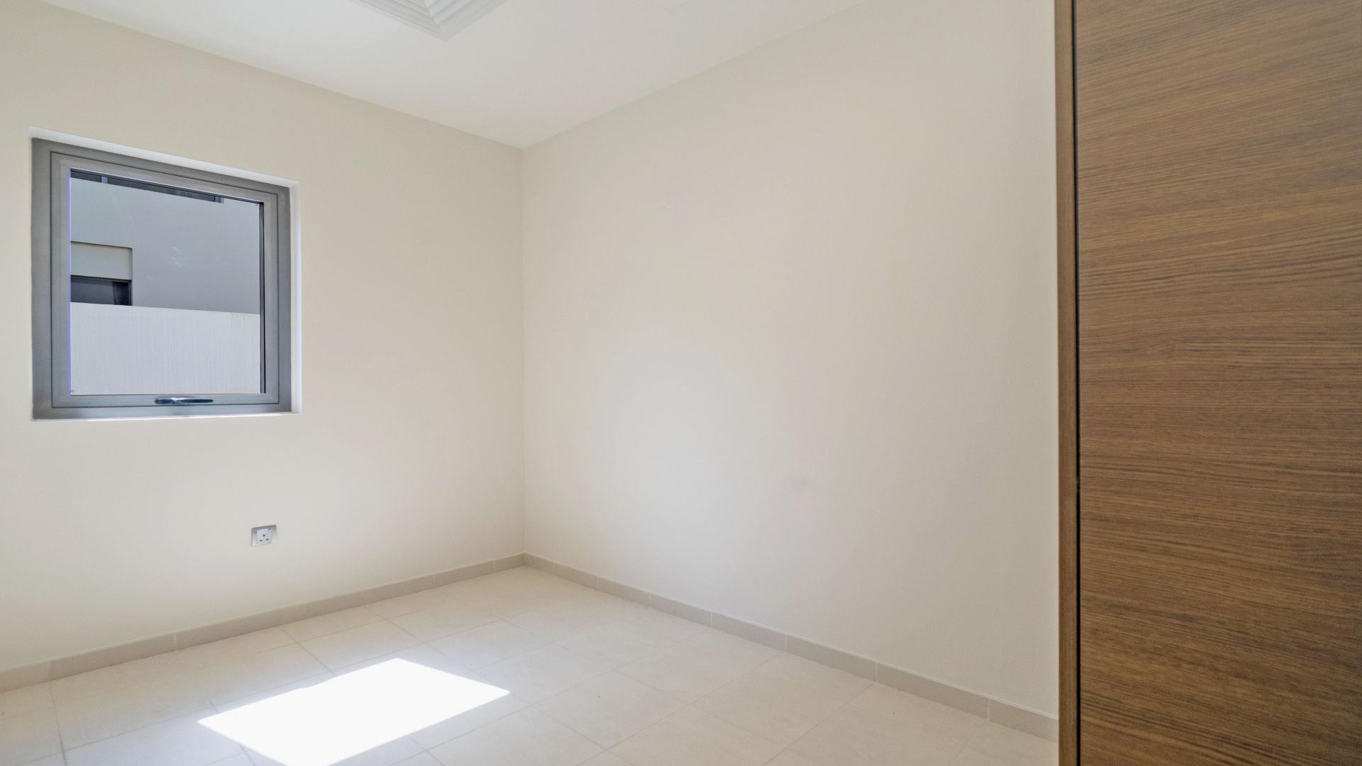 Open-plan kitchen and living area in Sidra Villas, Dubai Hills Estate. Elegant design and spacious layout