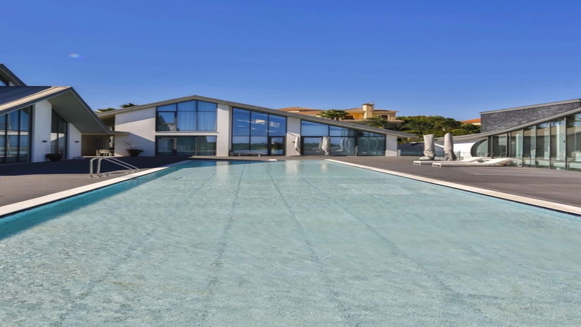 Aerial view of luxury villa with pool and tennis court in Sotogrande, Cadiz