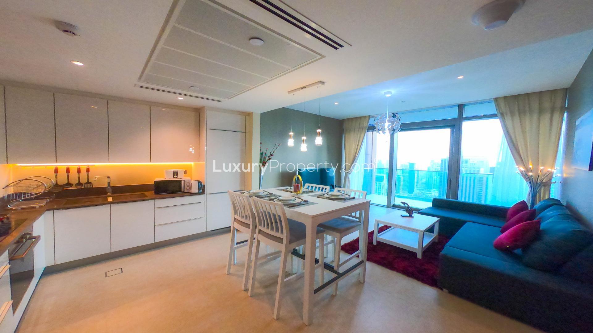 Furnished living room in Marina Gate apartment, Dubai Marina, with large windows and modern decor