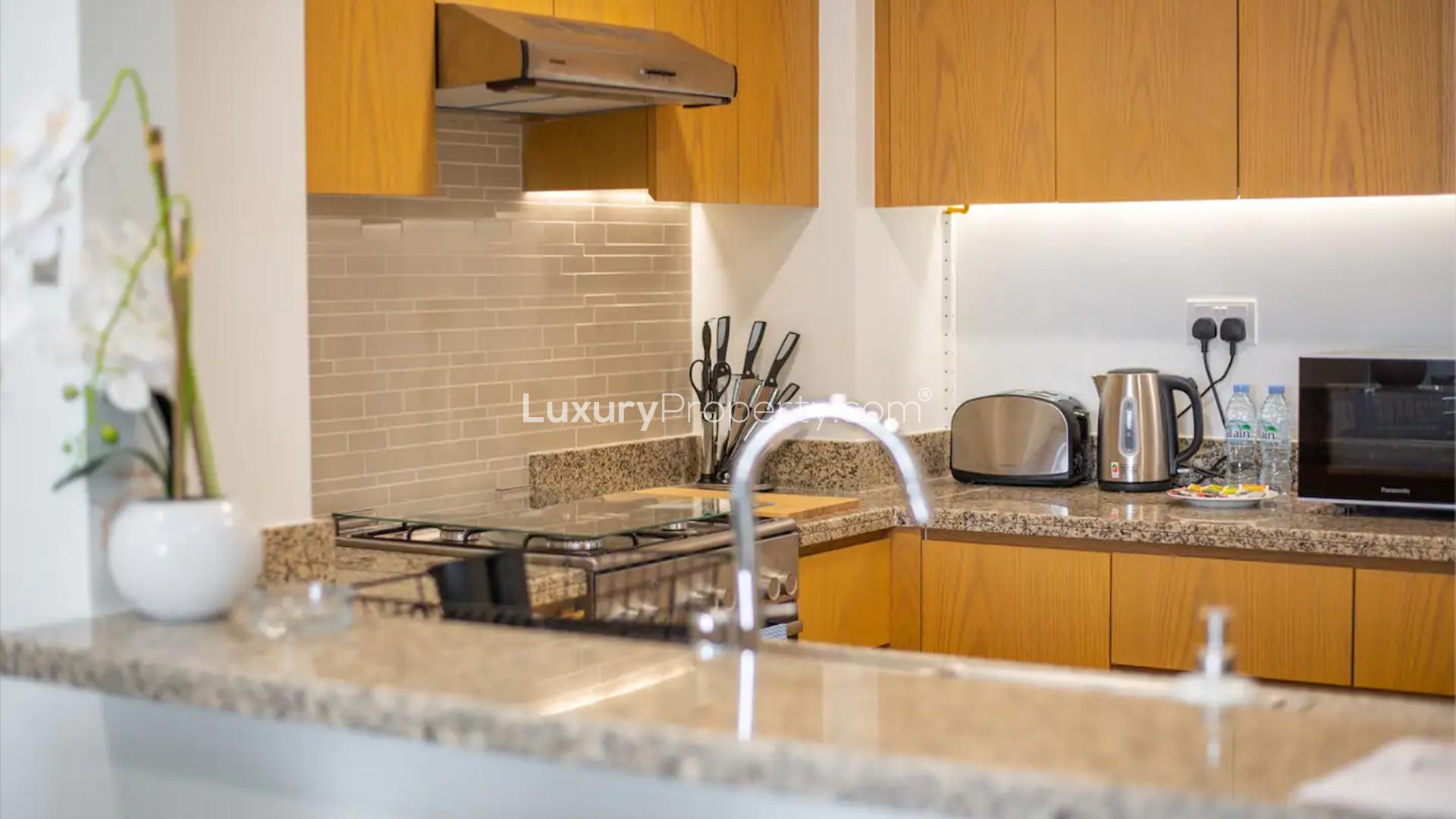 Modern kitchen with appliances in Bellevue Towers apartment, Downtown Dubai