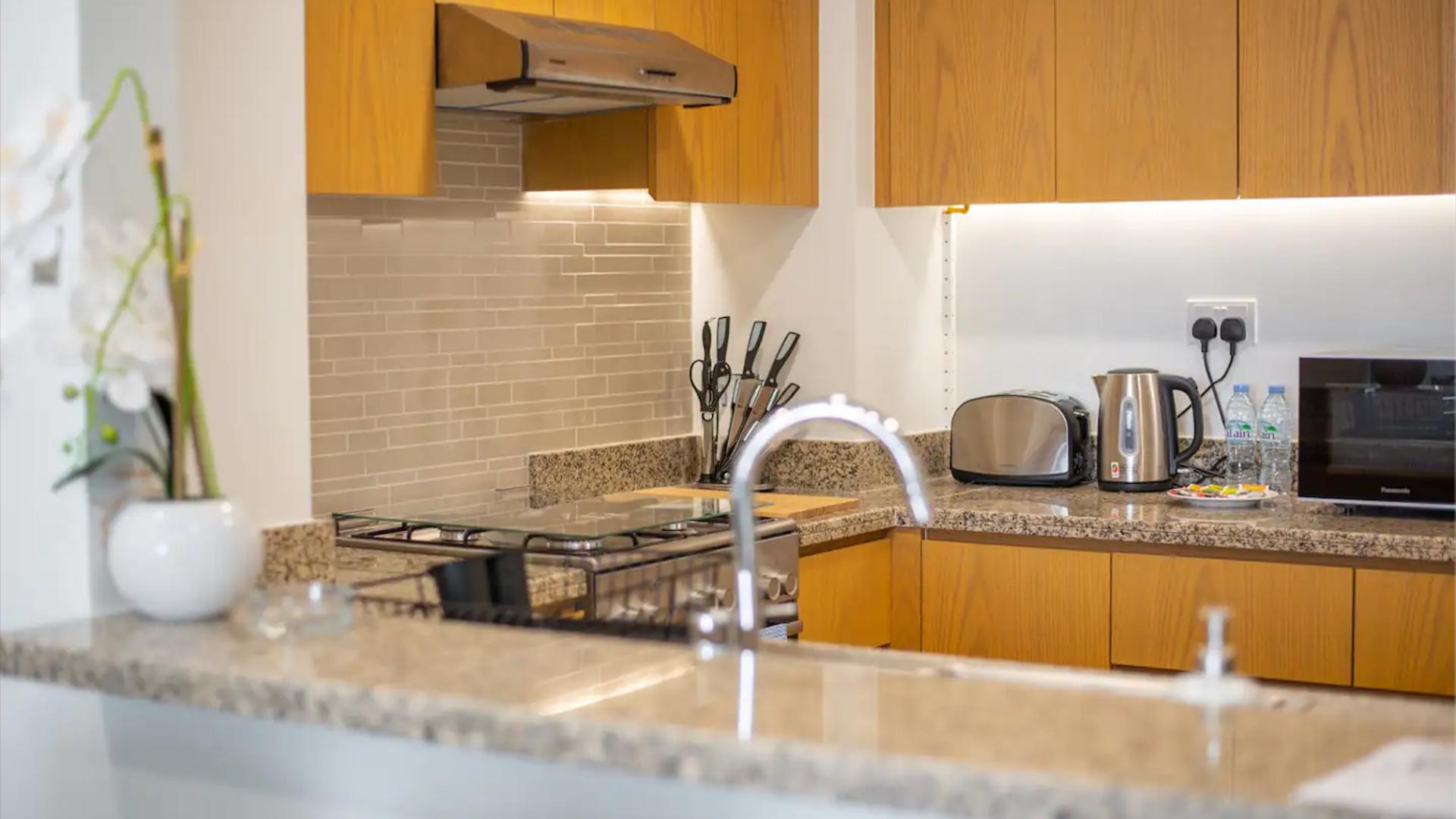 Modern kitchen with appliances in Bellevue Towers apartment, Downtown Dubai