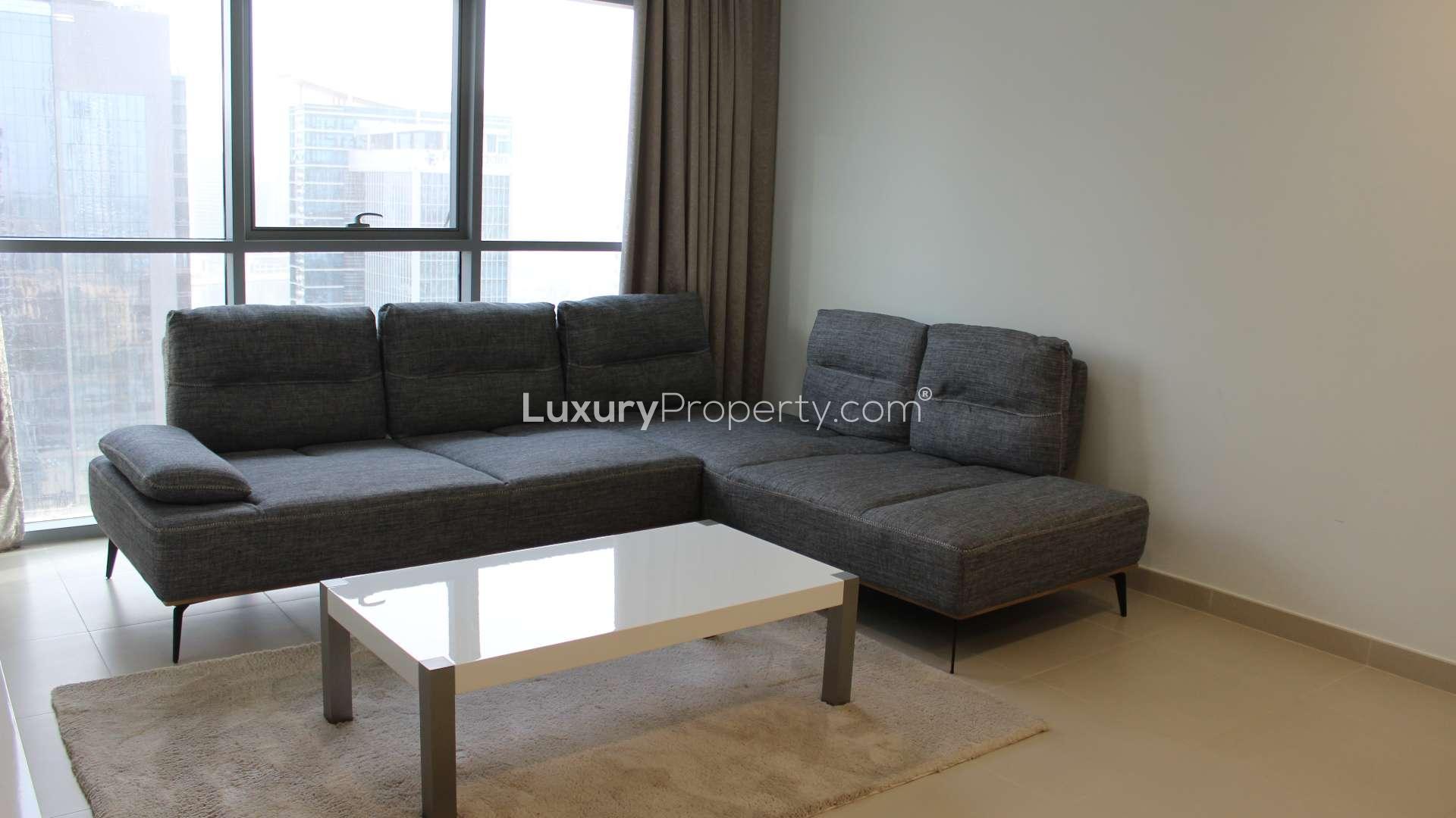 "Stunning Downtown Dubai view with pool, skyline, and Bellevue Towers apartment for rent.",Modern furnished living room in Bellevue Towers, Downtown Dubai apartment for rent. Ref: LP16481