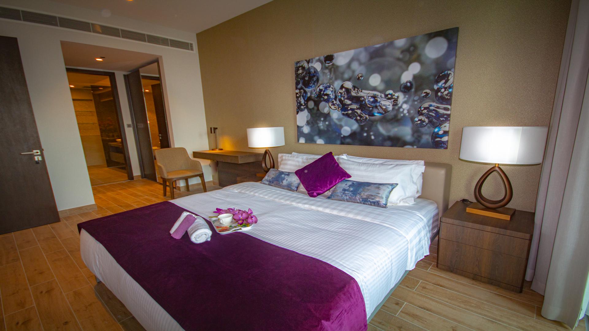 Luxurious bedroom in 1-bedroom apartment, Marina Gate, Dubai Marina, with elegant decor and lighting