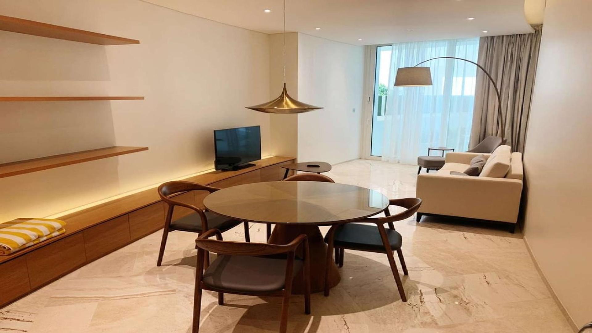 "Bright, modern living room in fully furnished 1-bed apartment at The Five Hotel, JVC.","Modern furnished living room in 1-bed apartment, Five Hotel, JVC, open layout, stylish decor.",Fully furnished living area in 1-bed apartment, Five Hotel, Jumeirah Village Circle