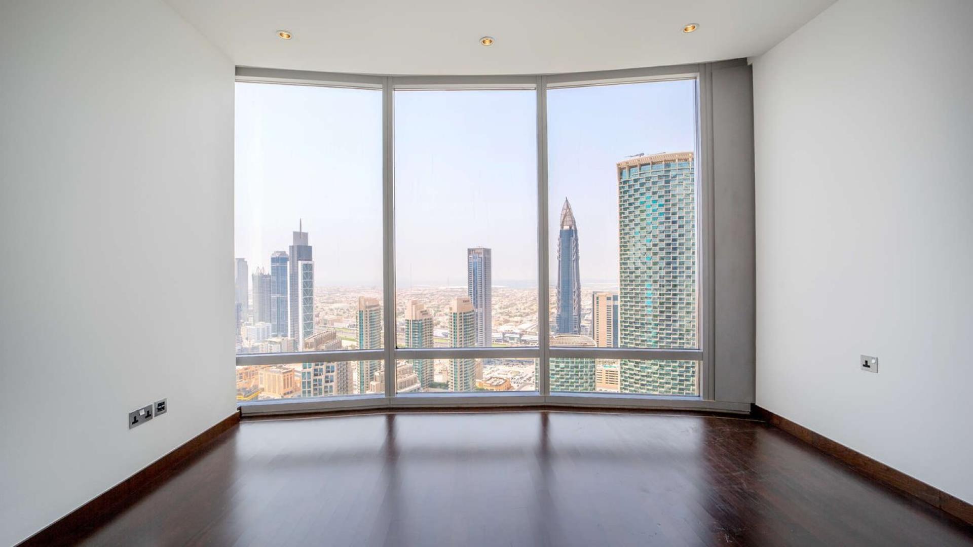Interior view of Downtown Dubai apartment with stunning skyline from large windows