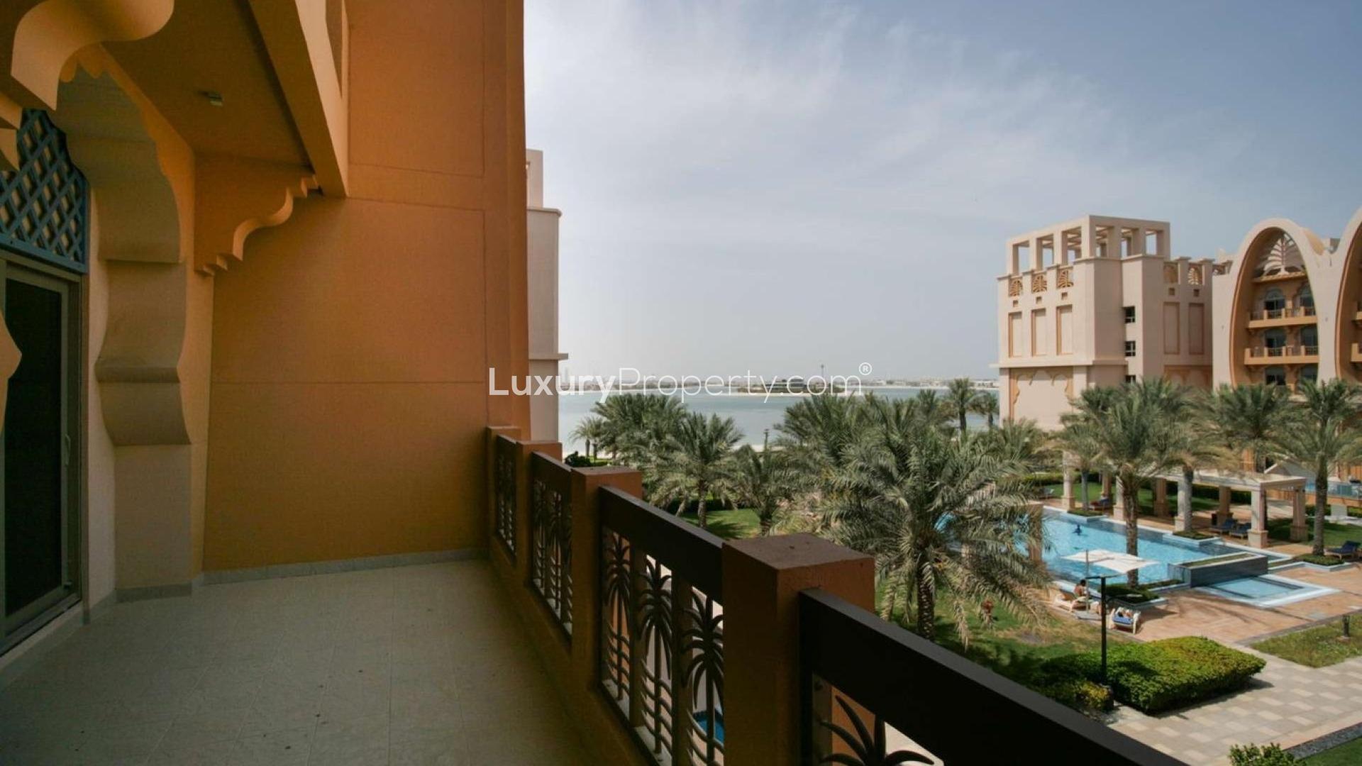 Empty living room in 1-bedroom beachfront apartment, Sarai Apartments, Palm Jumeirah, with tiled floors