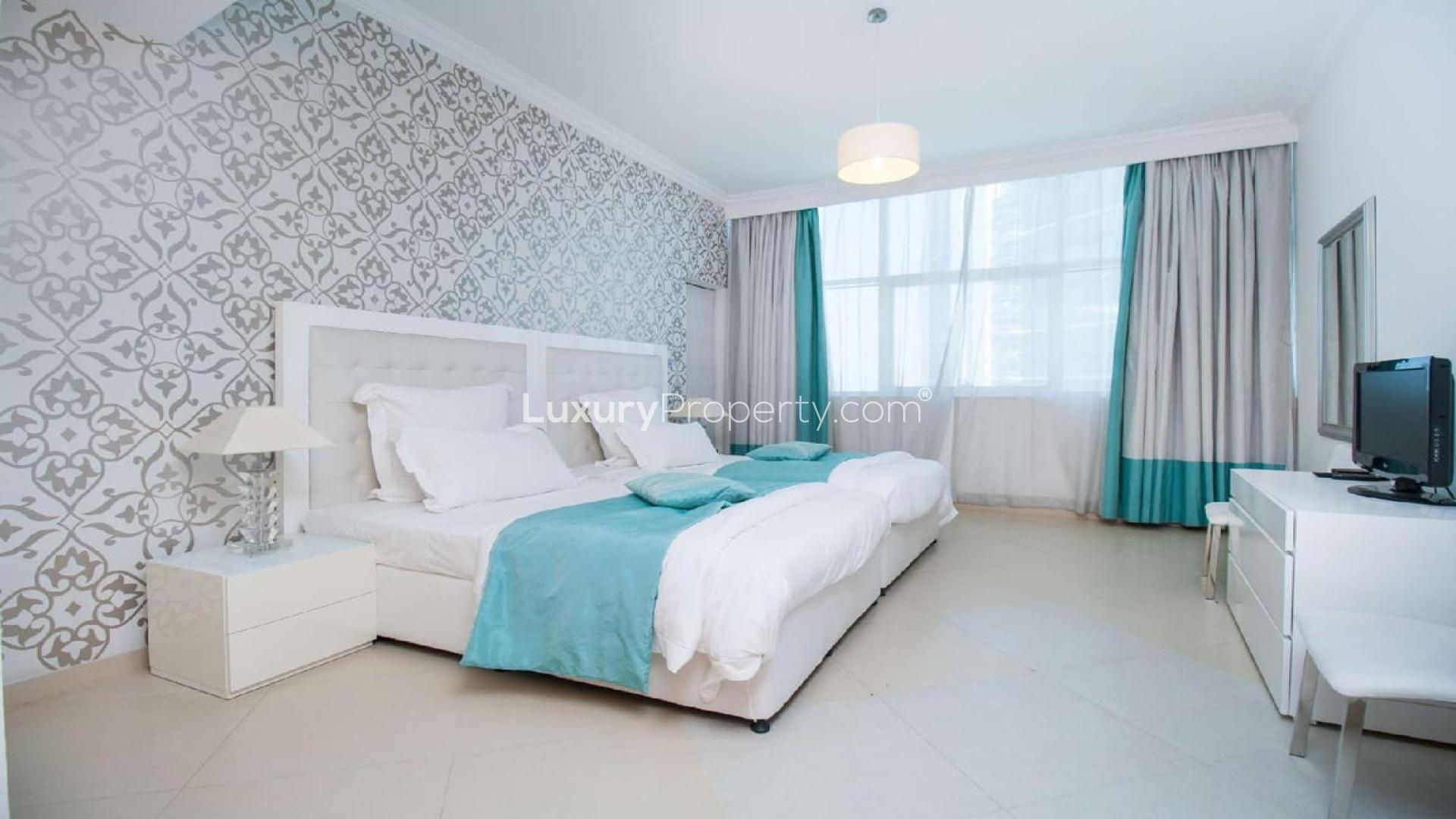 Modern living room in Dorra Bay apartment, Dubai Marina, featuring elegant decor and natural light