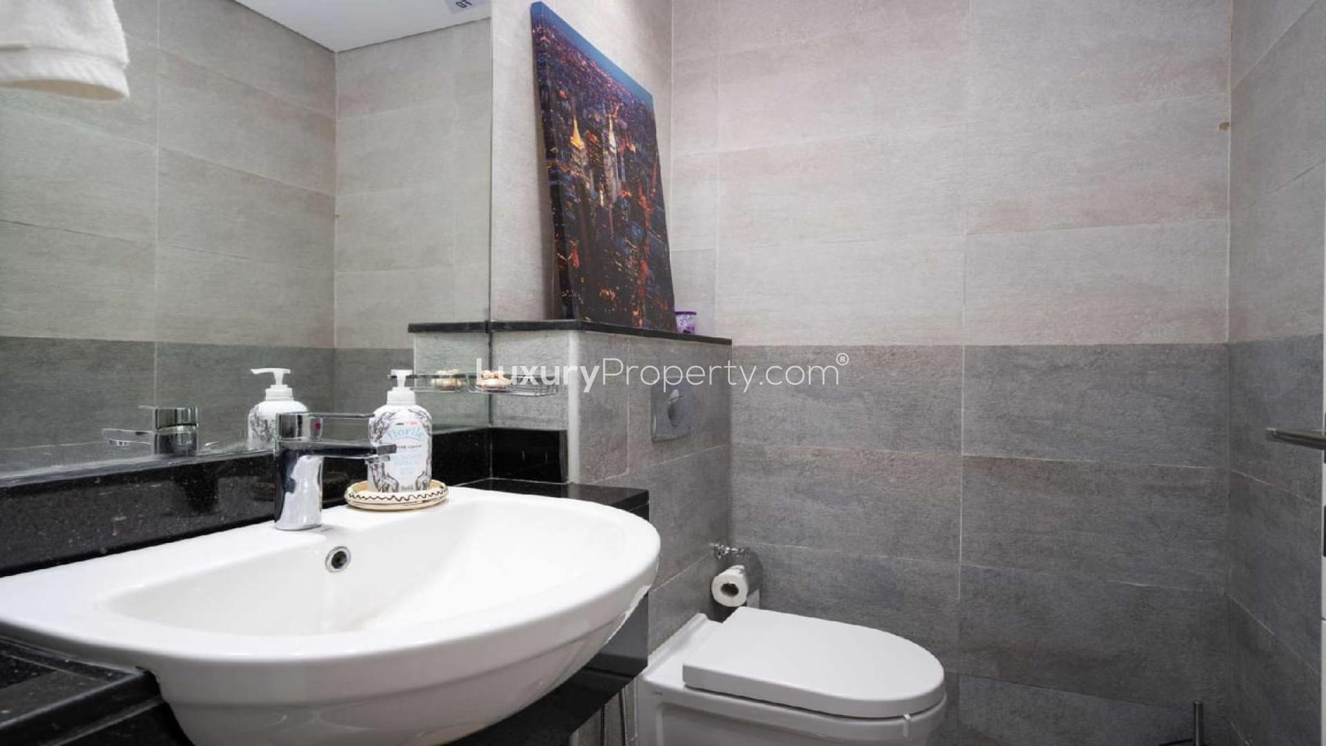 Luxurious furnished living room in 1-bedroom apartment, JVC, Dubai, with terrace view