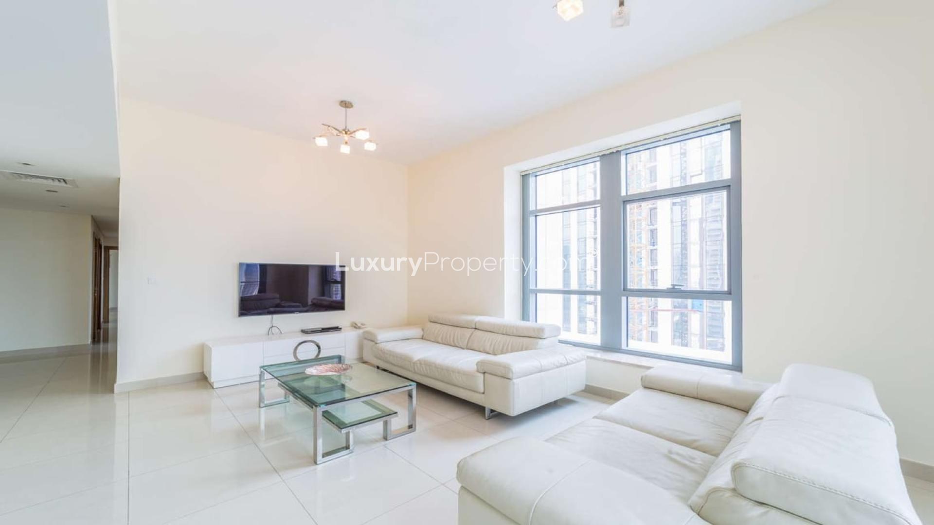 Spacious living room with modern furnishings in Claren Tower apartment, Downtown Dubai