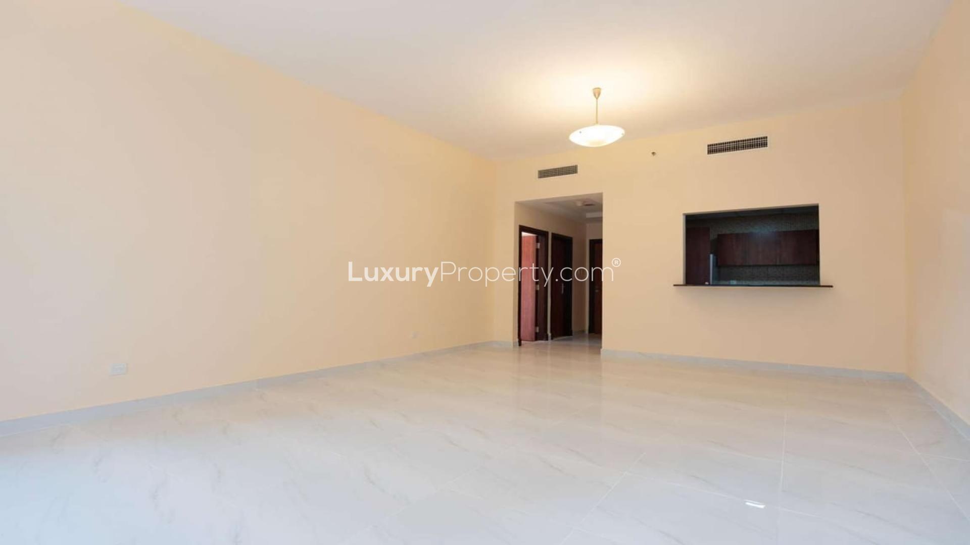 Renovated apartment interior, spacious living area, Olympic Park Towers, Dubai Sports City
