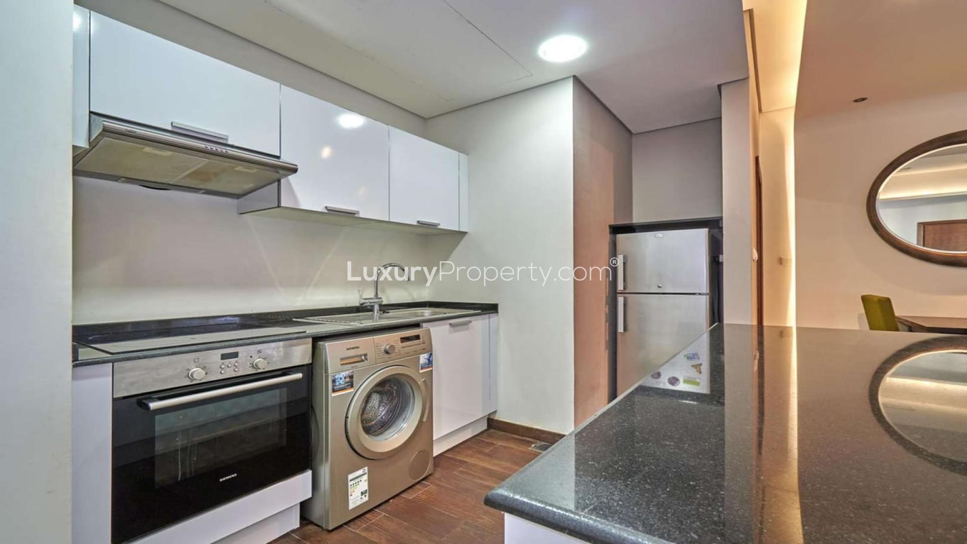 Modern living room and kitchen in 1-bedroom apartment, The Matrix Tower, Dubai Sports City