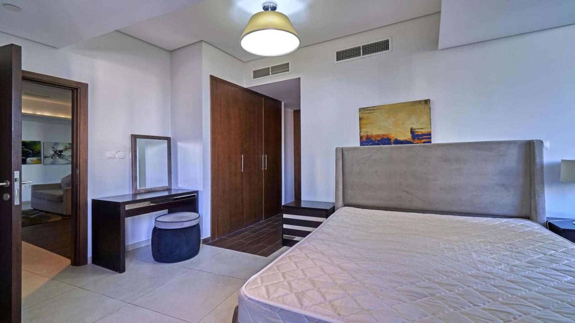 Modern open-plan living area in 1-bedroom apartment, The Matrix Tower, Dubai Sports City