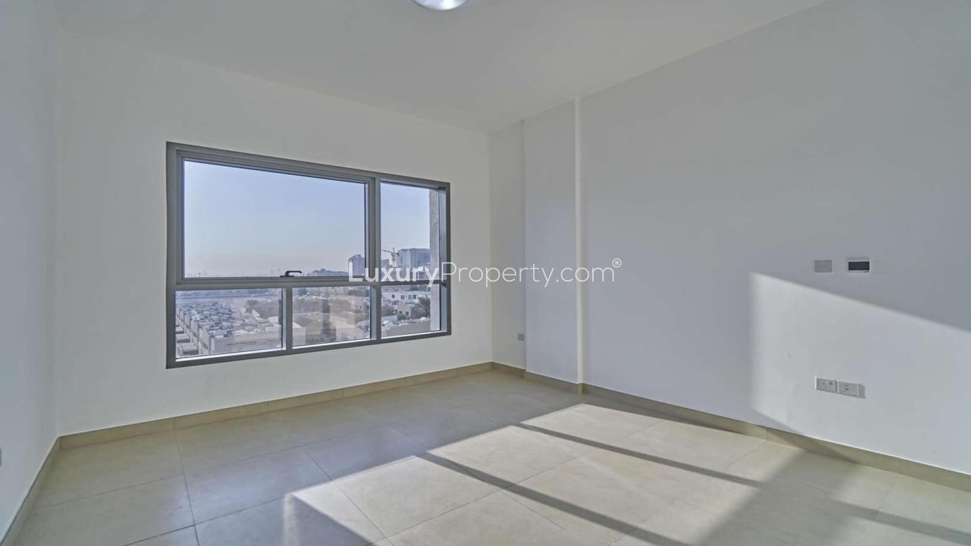 Modern apartment building exterior in Al Barsha, near Mall of the Emirates, for rent