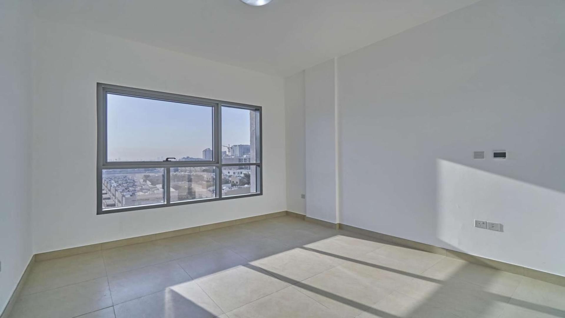 Modern apartment building exterior in Al Barsha, near Mall of the Emirates, for rent