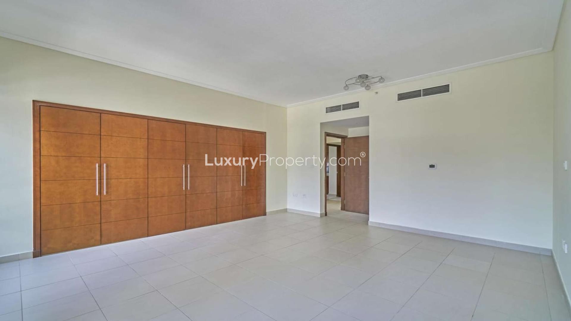 Studio apartment interior with large windows and built-in wardrobe, South Ridge 2, Downtown Dubai
