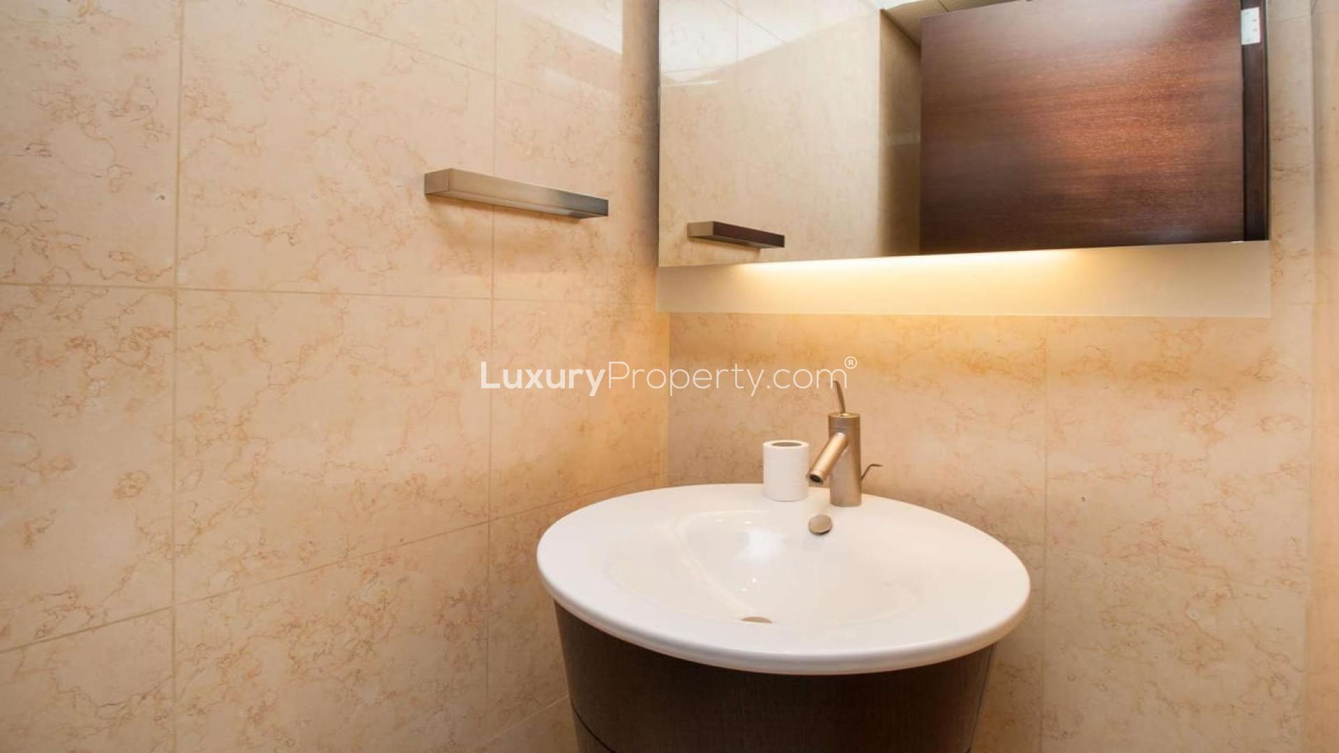 "Stunning cityscape view from 1-bedroom apartment in Burj Khalifa, Downtown Dubai for rent.",Modern bathroom in 1-bedroom apartment, Burj Khalifa, Downtown Dubai, featuring sleek sink and mirror