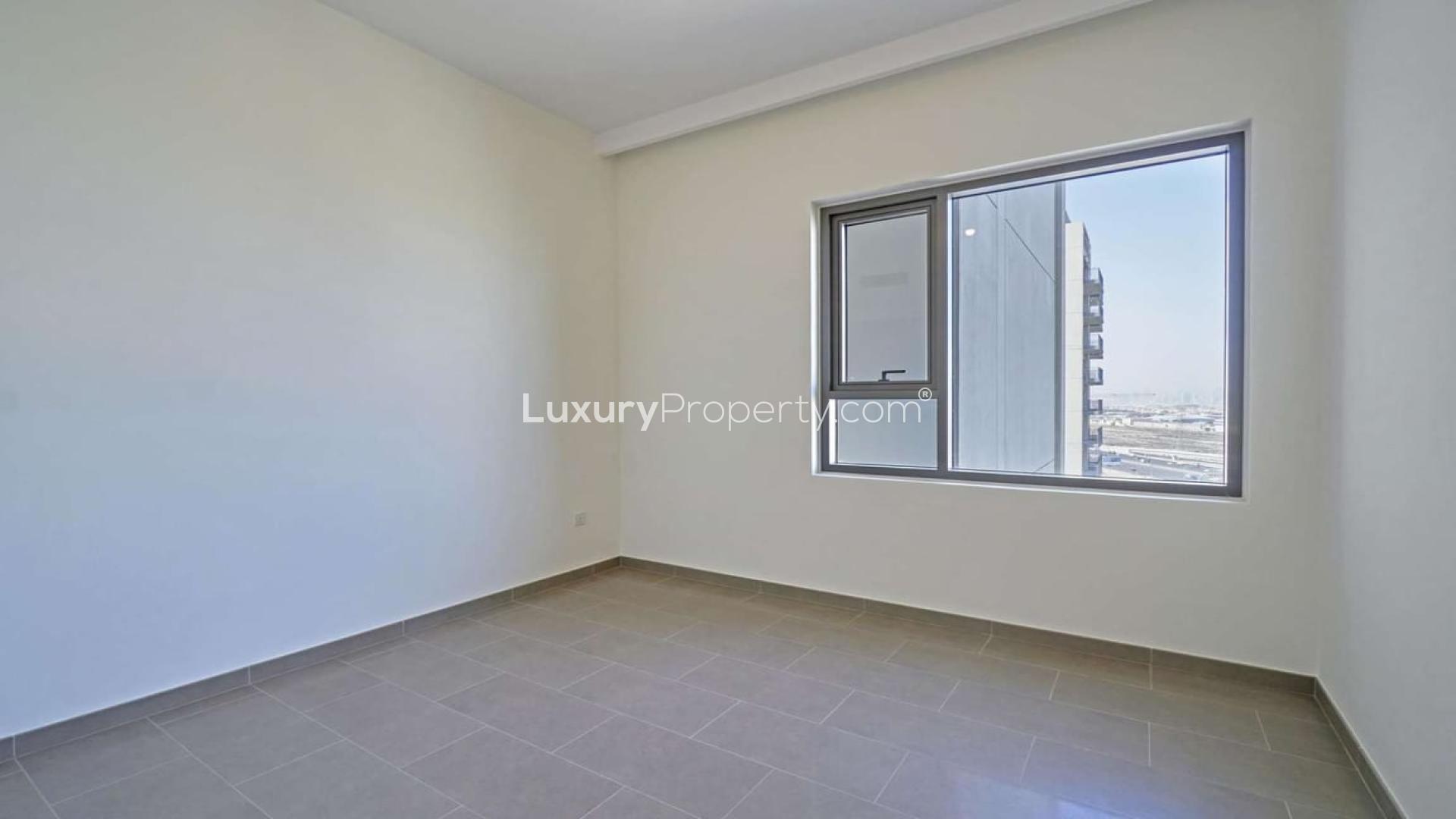 High-floor apartment view with pool, Dubai Hills Estate, Park Heights, Burj Al Arab visible