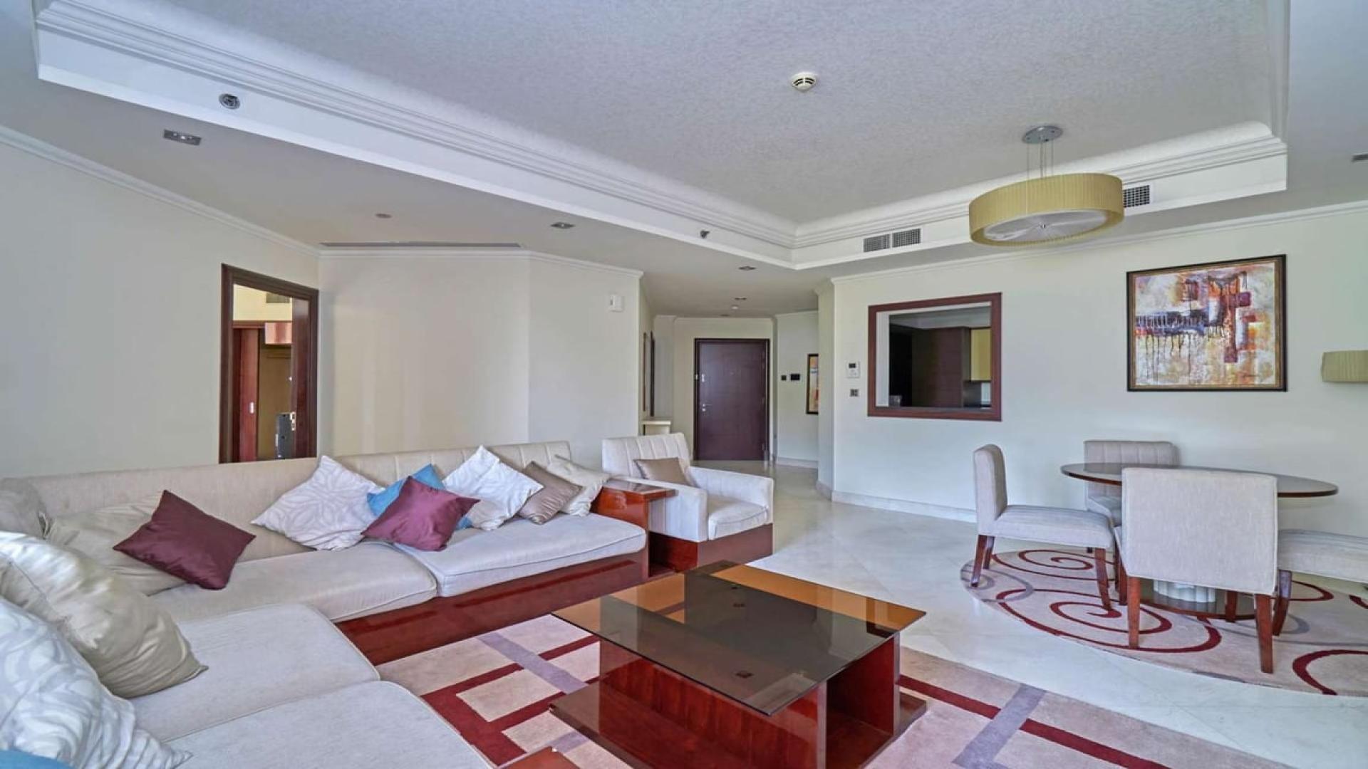 "Grandeur Residences exterior view, Palm Jumeirah apartment for rent, luxury architecture facade.",Fully furnished living room in Grandeur Residences, Palm Jumeirah apartment for rent