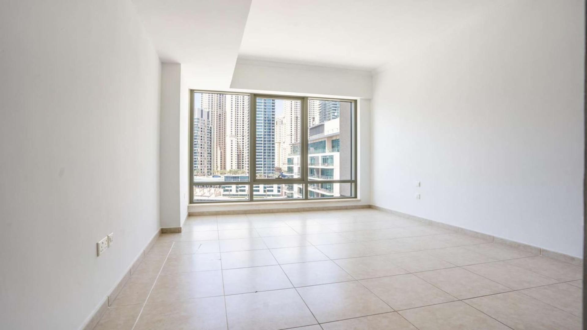 Bright living area with marina view in 1-BR Al Majara Tower apartment, Dubai Marina