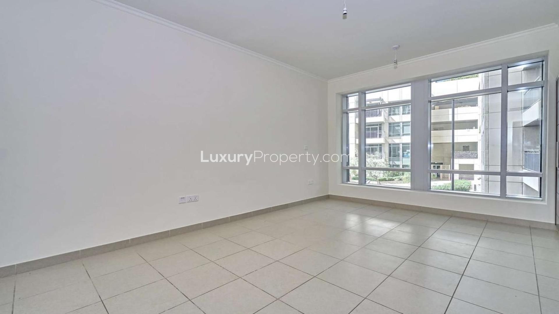 Bright living area with large windows in Burj Views apartment, Downtown Dubai