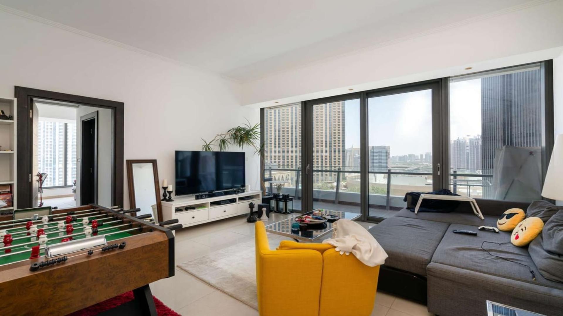 Modern living room in Silverene Tower B apartment, Dubai Marina, with city view