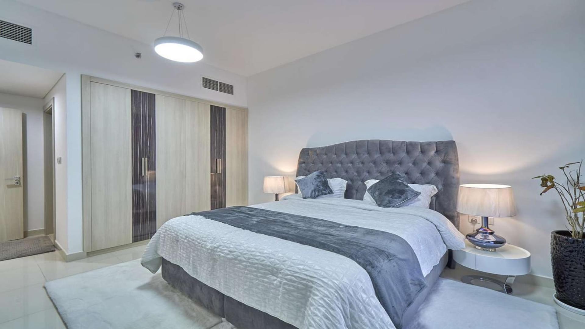 Modern kitchen in Jumeirah Village Circle 1-bedroom apartment for rent, sleek cabinetry, and appliances