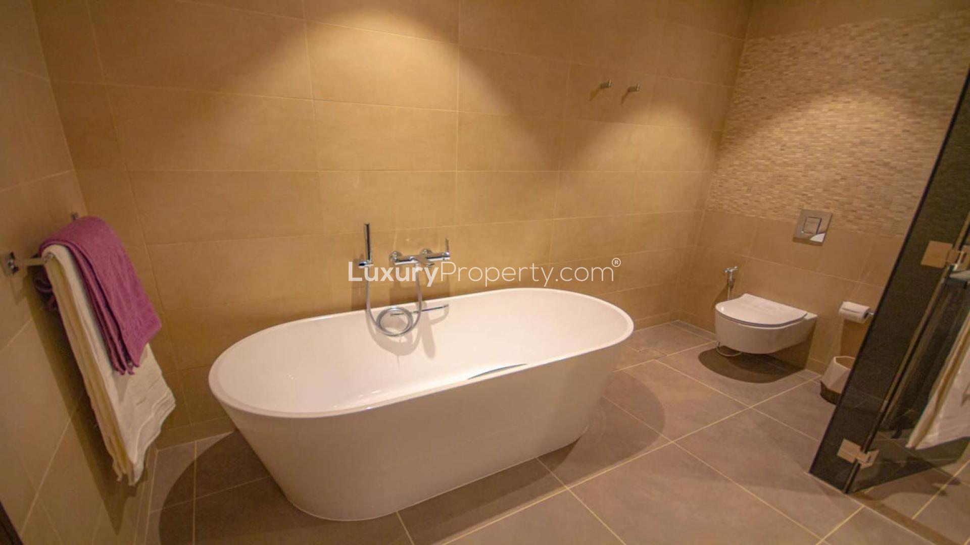 Modern open-plan kitchen and dining area in Jumeirah Living Marina Gate apartment, Dubai Marina