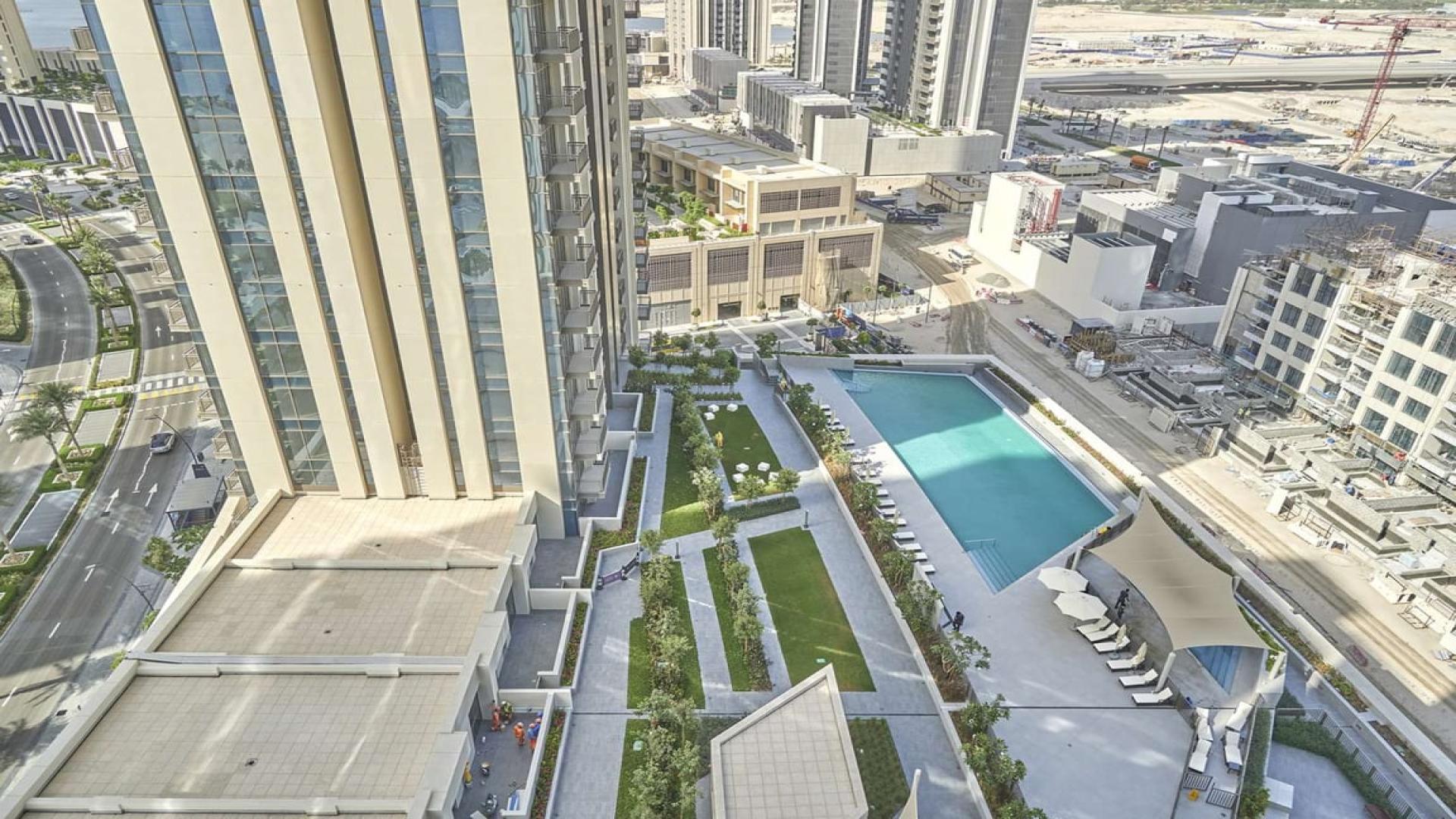 Rooftop pool with city views at Creekside 18, Dubai Creek Harbour apartment