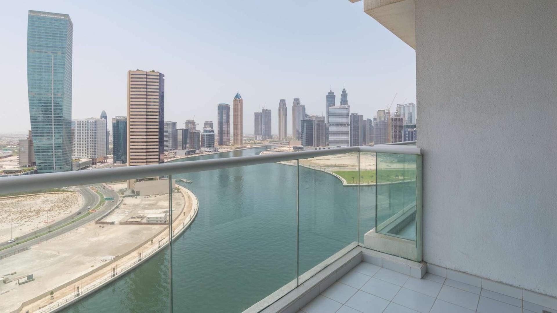 Balcony view from 1-bedroom apartment in Damac Maison Prive, Business Bay, overlooking canal