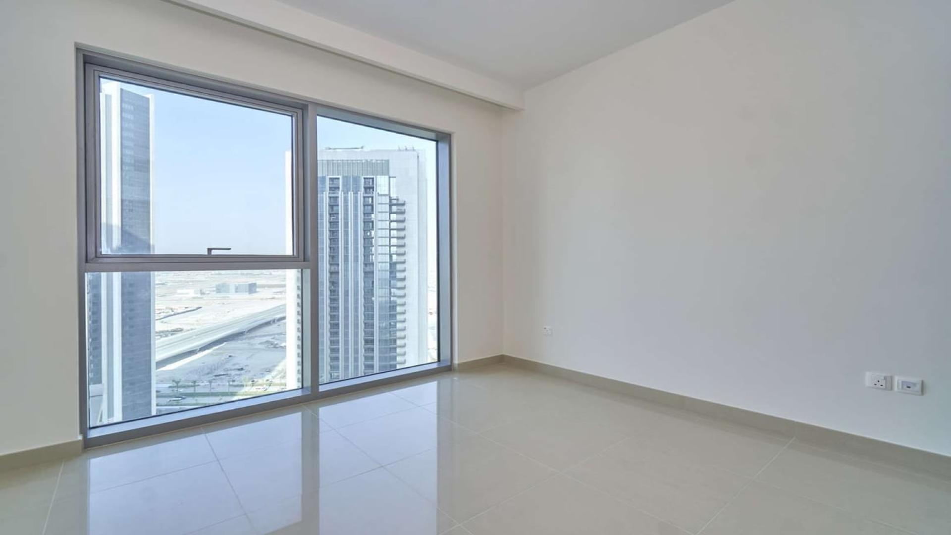 Balcony view from 1-bedroom apartment in Dubai Creek Harbour, overlooking modern skyline