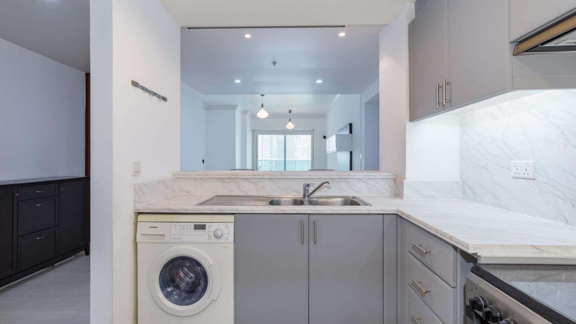 Luxury apartment living room with balcony view in Al Murjan Tower, Dubai Marina