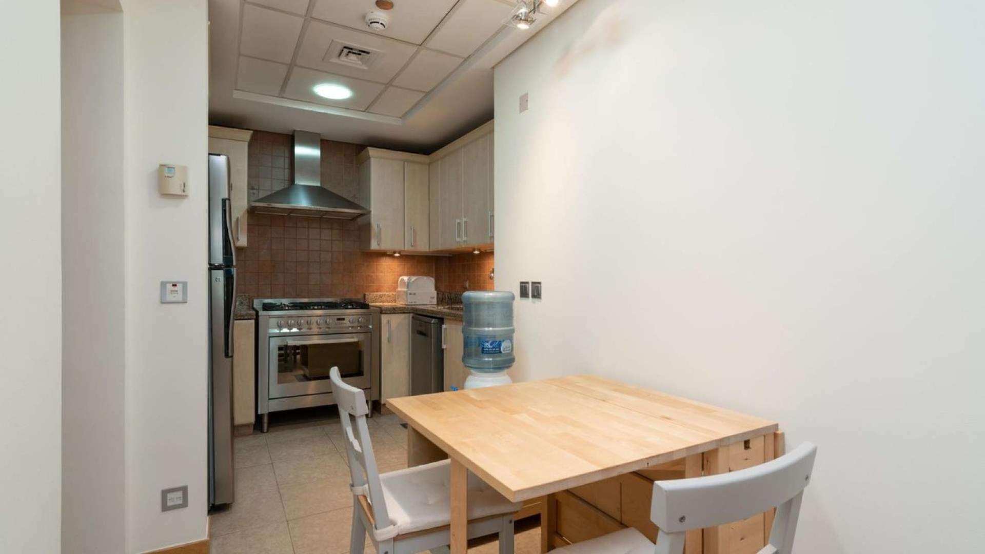 Compact kitchen with dining area in Shoreline Apartments, Palm Jumeirah rental unit