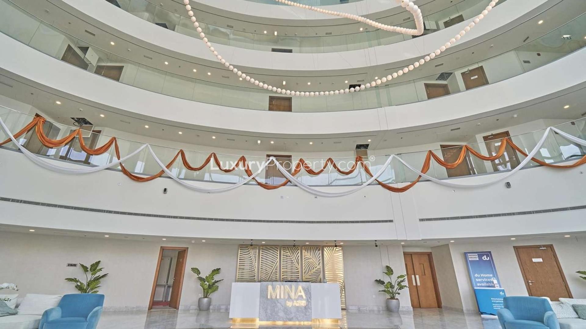 Empty living room with large windows in Palm Jumeirah apartment for rent