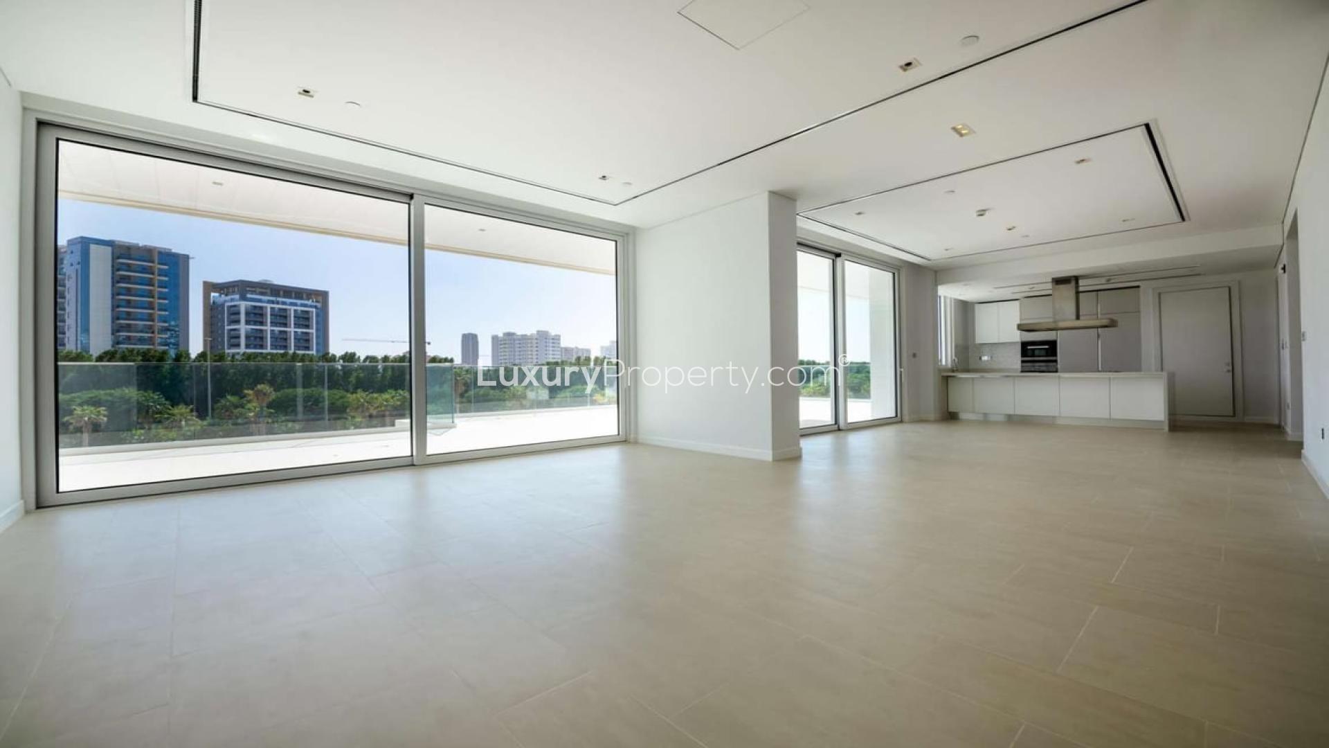 Spacious Al Barari apartment interior with large windows and modern kitchen in Seventh Heaven