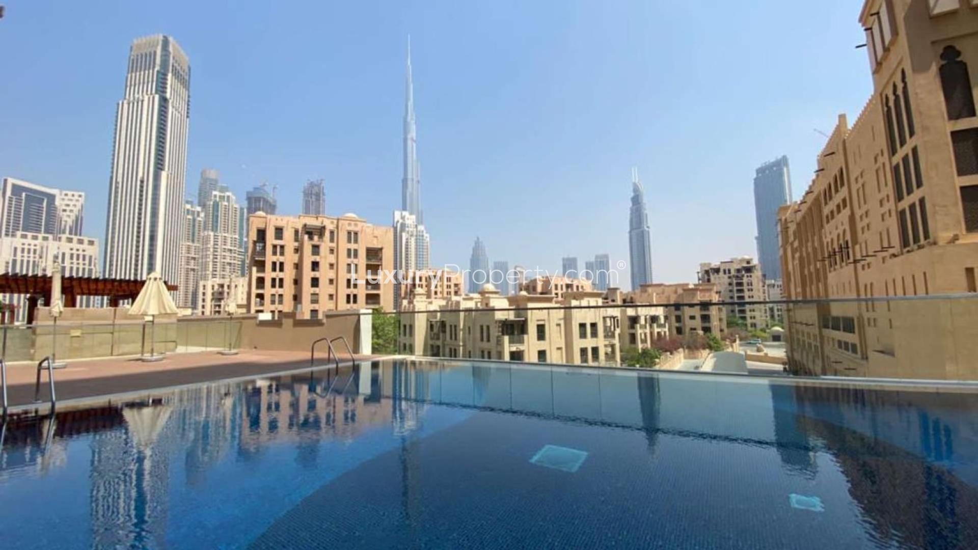 Rooftop pool view with Downtown Dubai skyline from Bellevue Towers apartment for rent