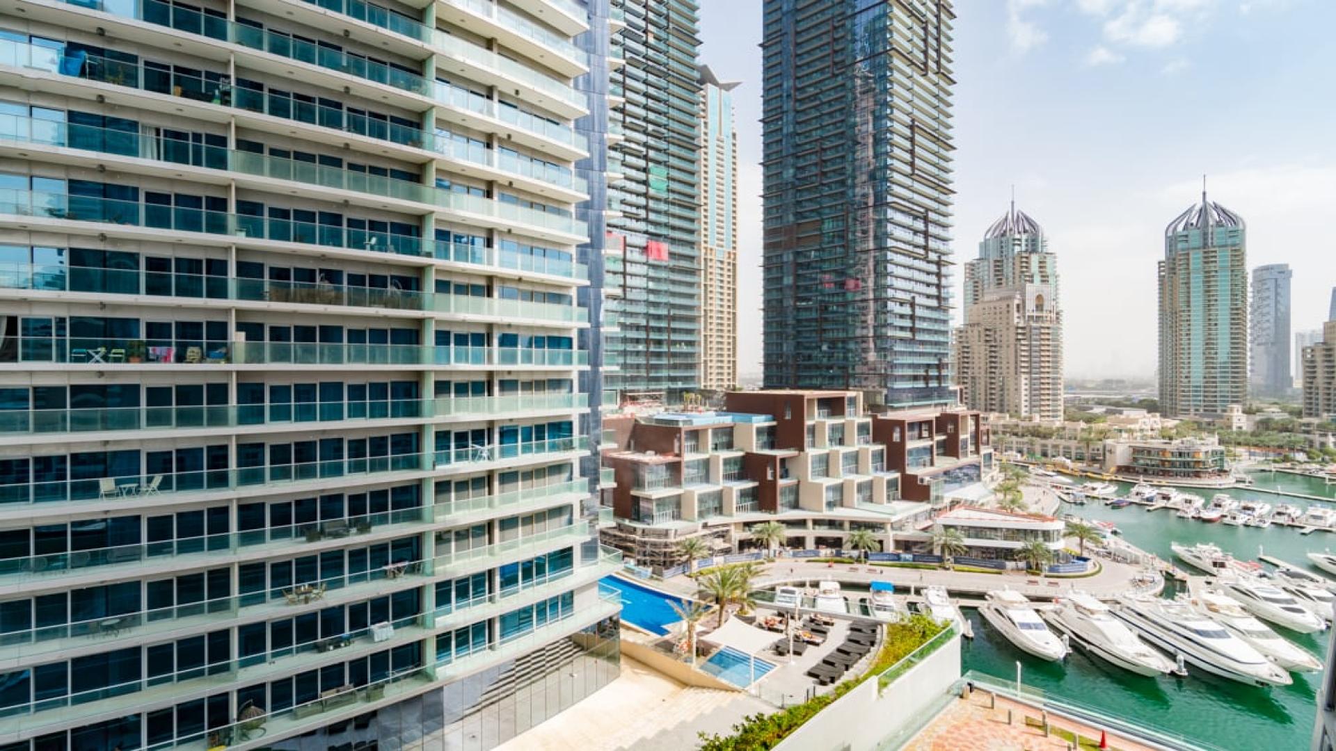 Luminous 1-bed apartment view in Cayan Tower, overlooking Dubai Marina's waterfront