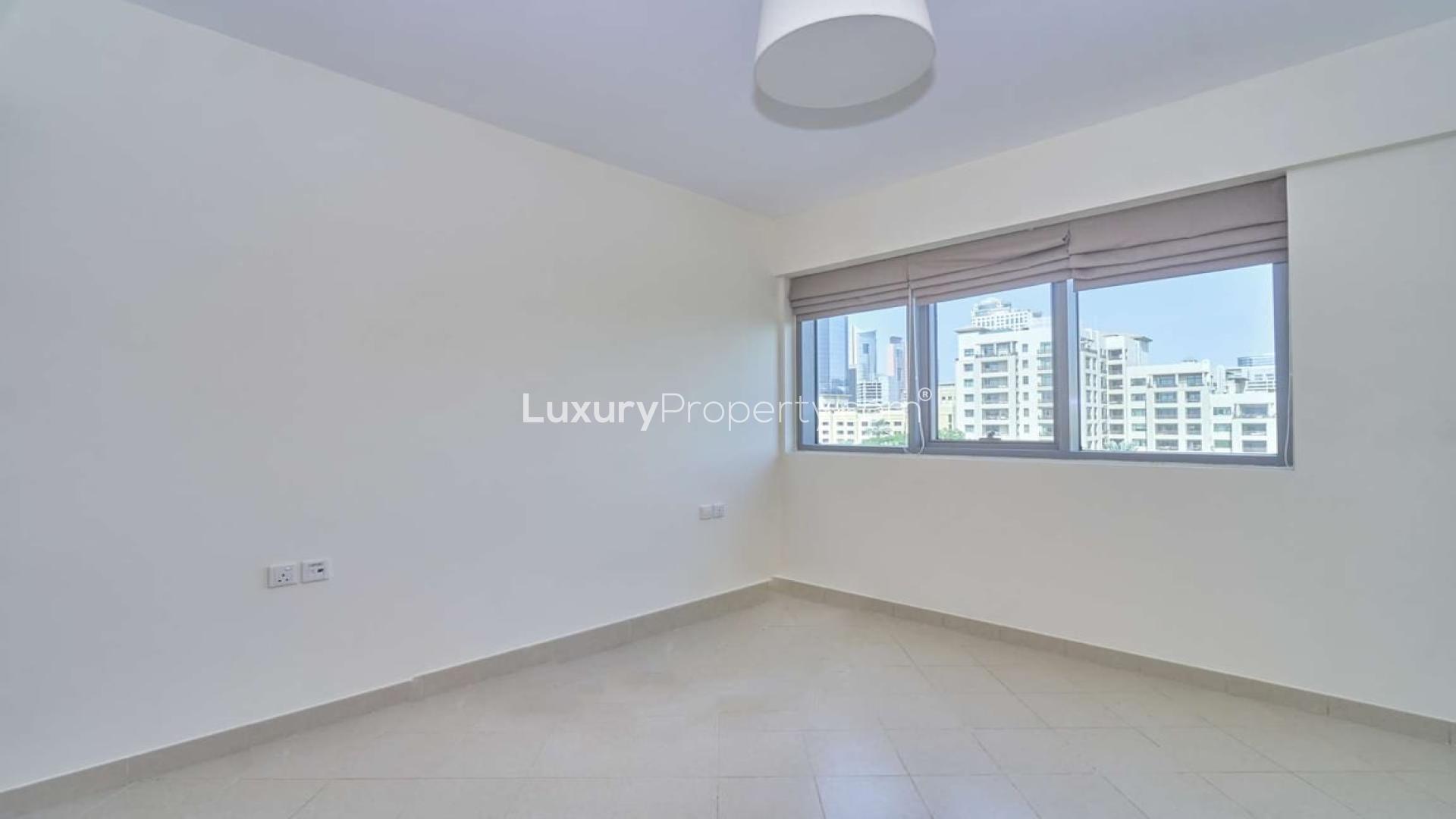 Modern kitchen in 1-bedroom apartment, Golf Towers, The Views, with granite countertops and city view