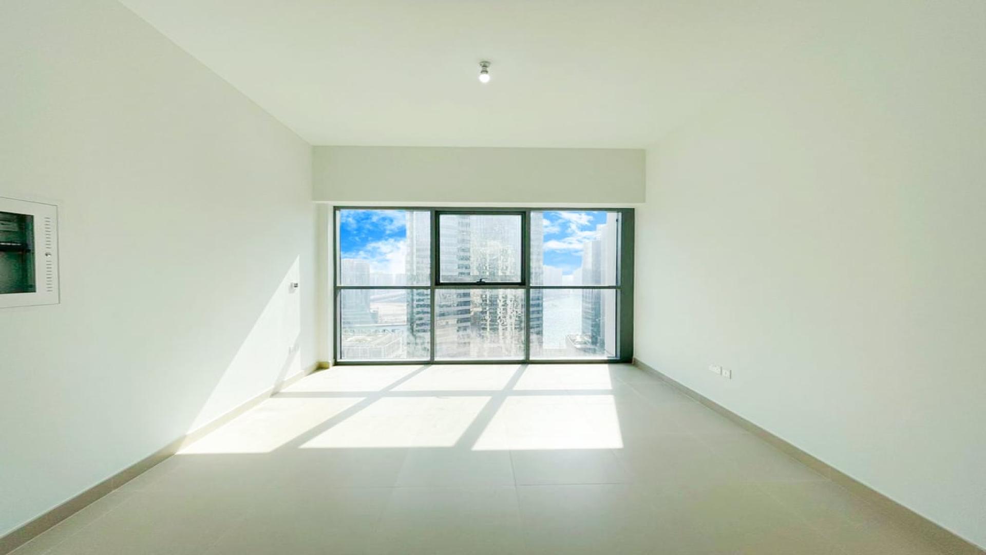 Modern kitchen and living area in Bellevue Towers apartment, Downtown Dubai, with city views