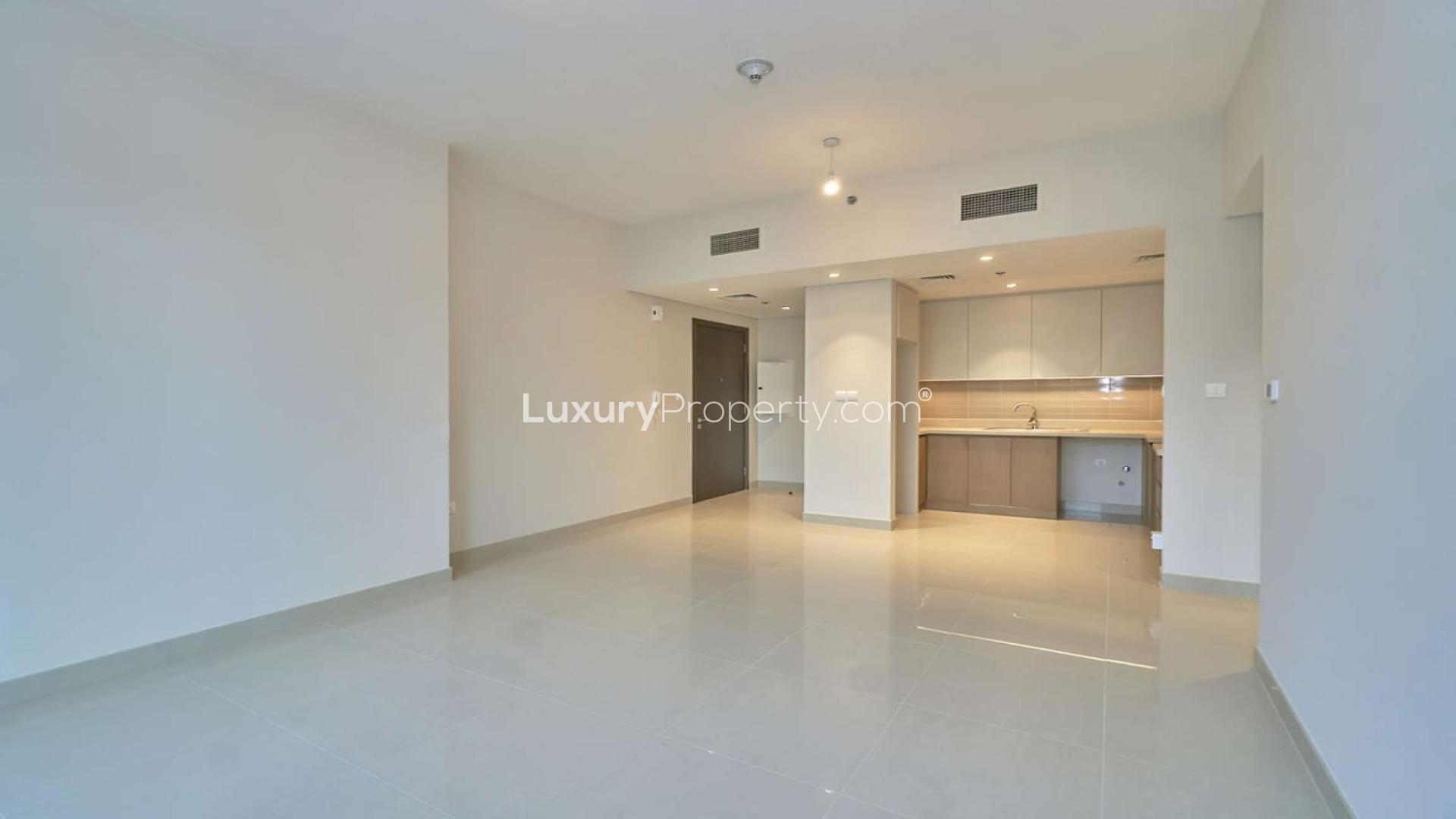 Balcony view from 1-bedroom apartment in Dubai Creek Harbour, overlooking courtyard and skyscrapers
