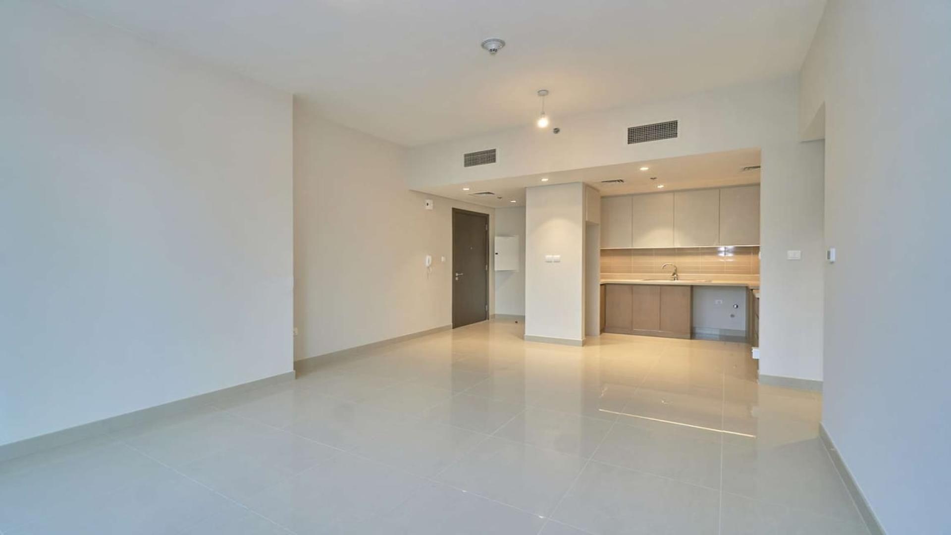 Balcony view from 1-bedroom apartment in Dubai Creek Harbour, overlooking courtyard and skyscrapers