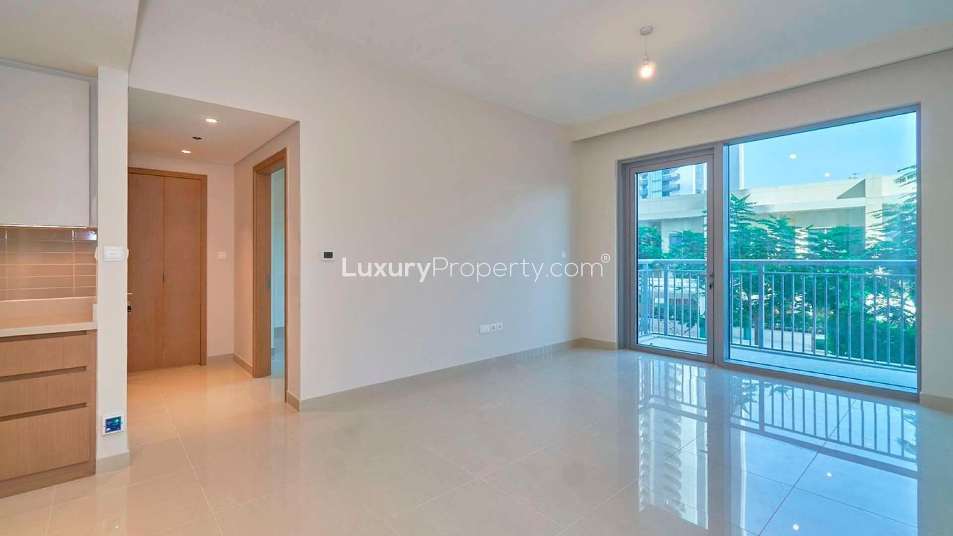 Charming Dubai Creek Harbour apartment interior with large windows and courtyard views