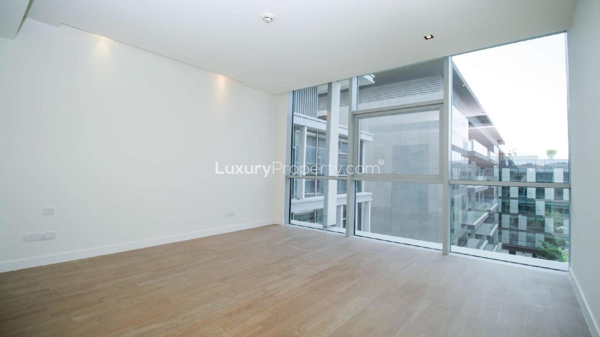 Contemporary open-plan kitchen and living area in City Walk one-bedroom apartment for rent