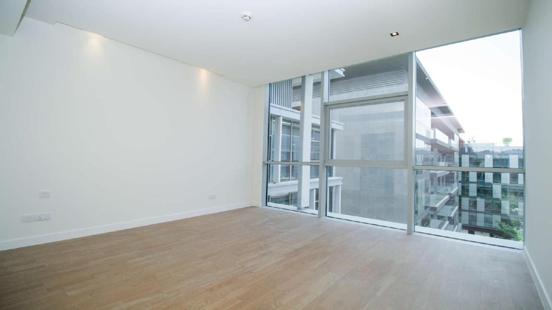 Contemporary open-plan kitchen and living area in City Walk one-bedroom apartment for rent