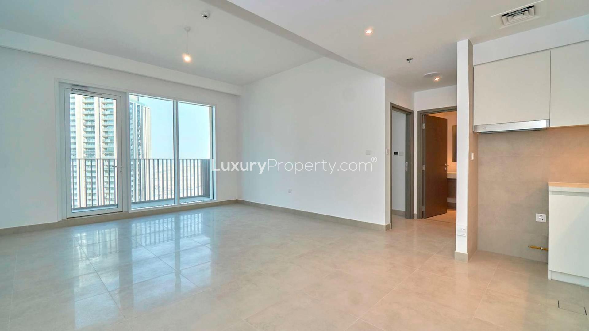 High-floor 1-bedroom apartment interior with modern kitchen in Dubai Creek Harbour