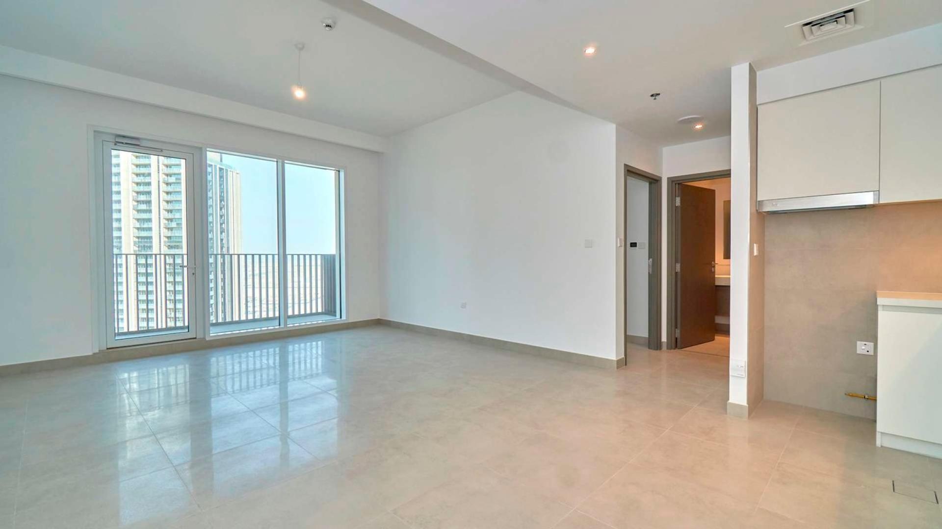 High-floor 1-bedroom apartment interior with modern kitchen in Dubai Creek Harbour