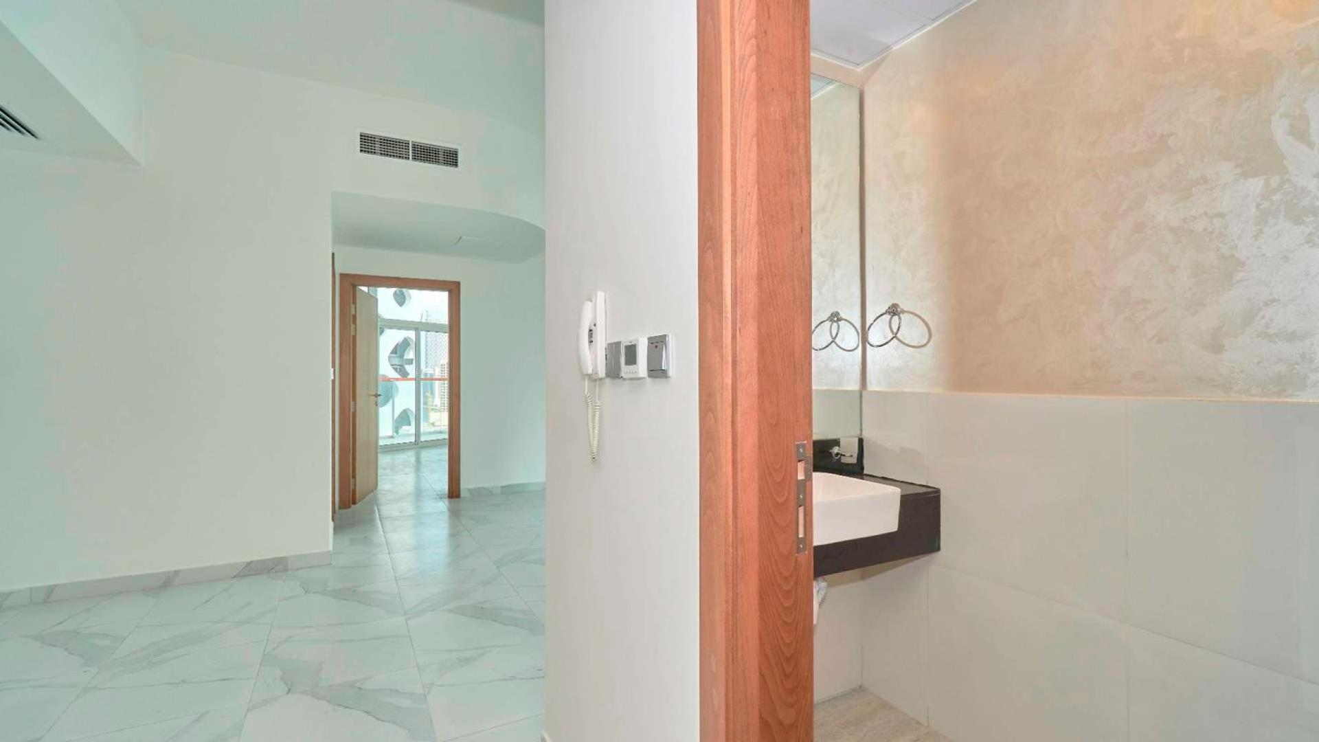 Balcony view from Millennium Binghatti Residences apartment overlooking Business Bay skyline and water