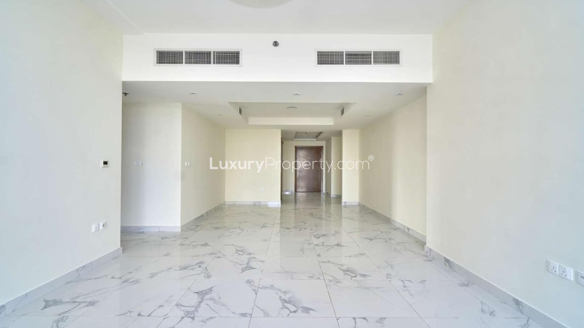 "Spacious apartment balcony with stunning canal views in Al Habtoor City, Business Bay.",Spacious apartment interior with marble flooring in Al Habtoor City, Business Bay for rent